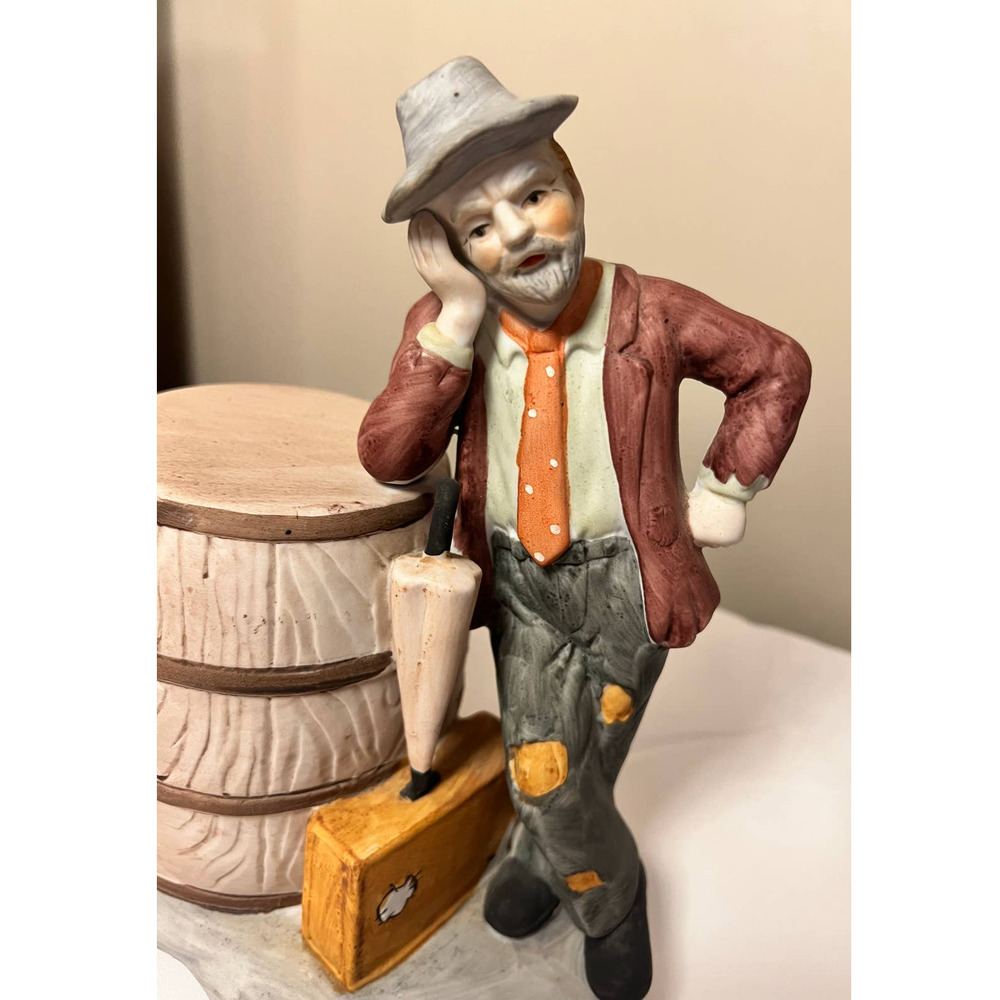 J. J. Crown Hobo Leaning on a Barrel with‎ an Umbrella & Suitcase Series 1200